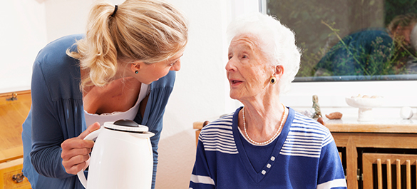 Image of a Memory Care Resident and a Caregiver in an Assisted Living Care Home